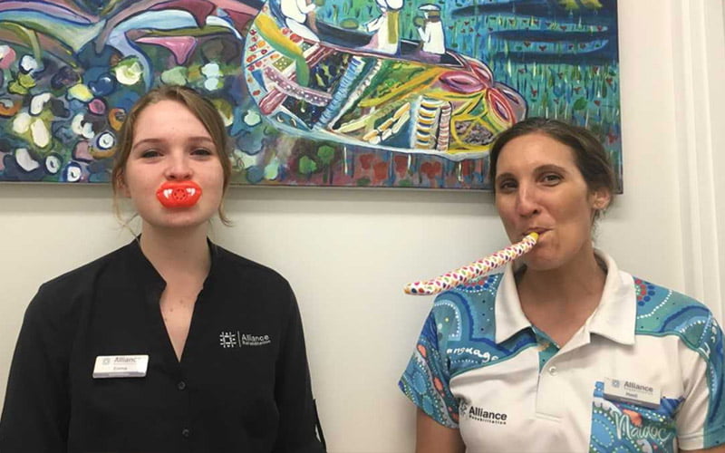 Vocal Health Two staff members with speech therapy toys