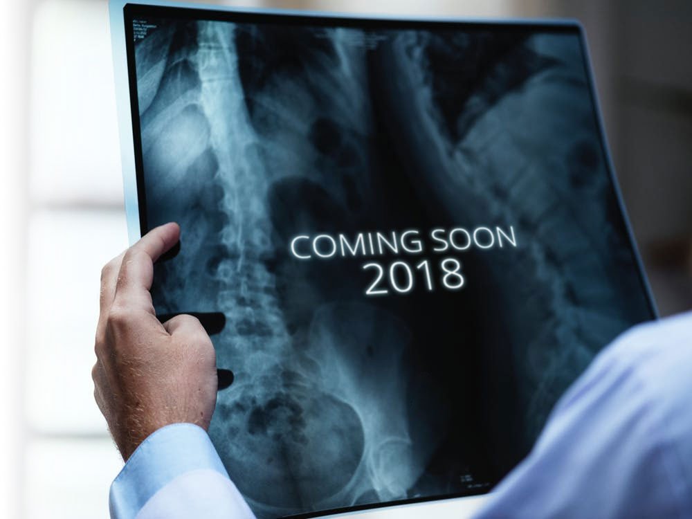 Medical GP Coming Soon Doctor looking at xray with the words coming soon on it