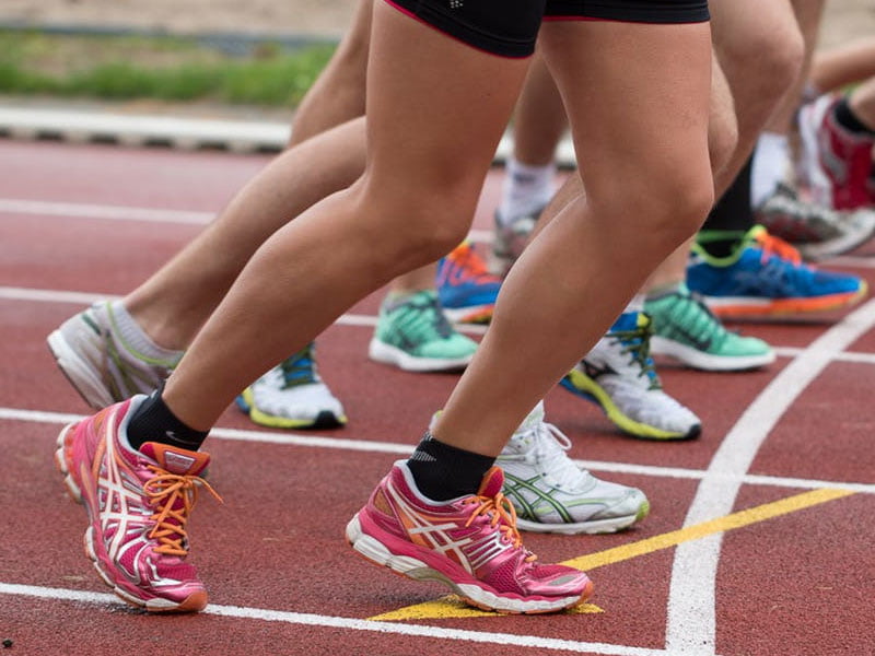 Group therapy Townsville Close-up of people on running track