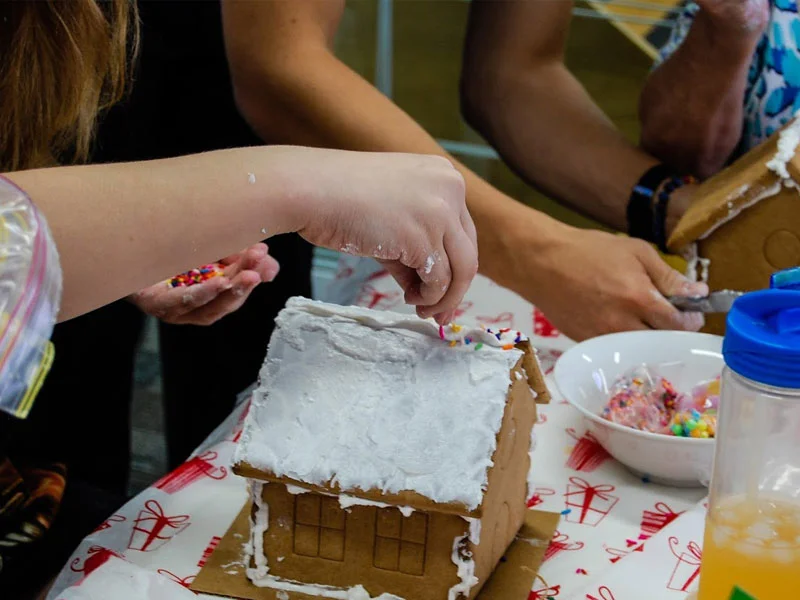 People making gingerbread houses as a therapy exercise
