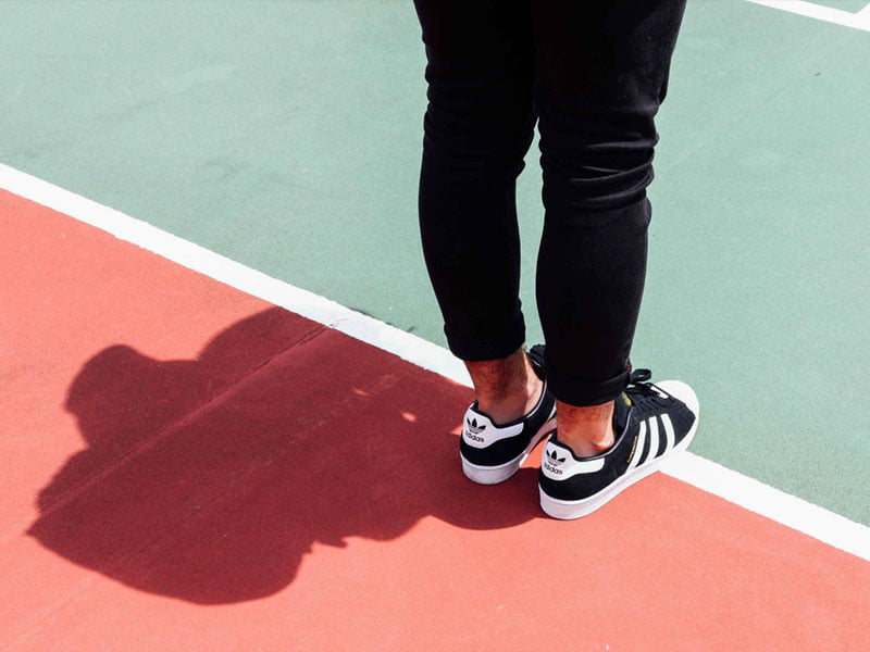 Closeup of woman standing on running track