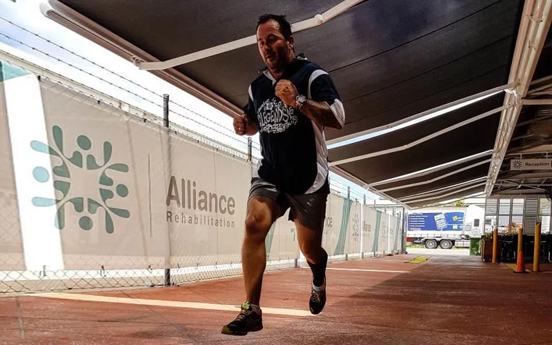 Man running while in rehabilitation at Alliance Rehabilitation