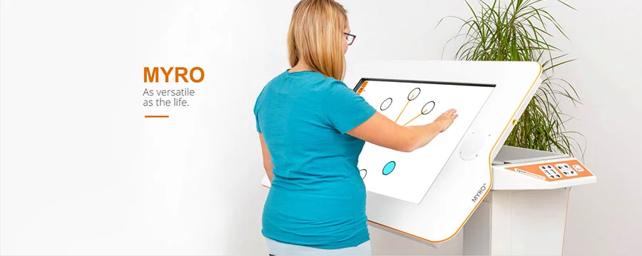 Woman using large Myro tablet workstation