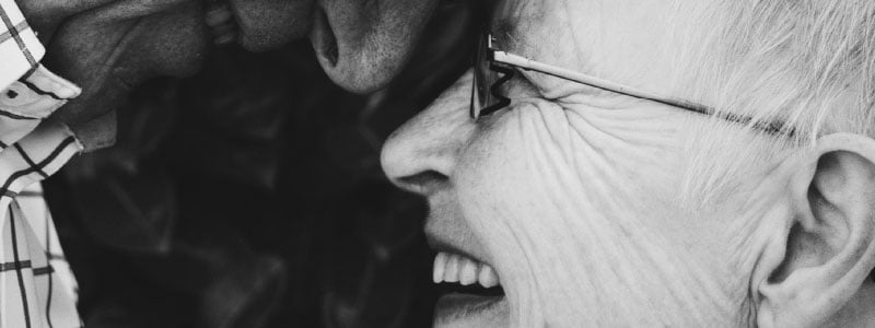 Happy elderly couple embracing