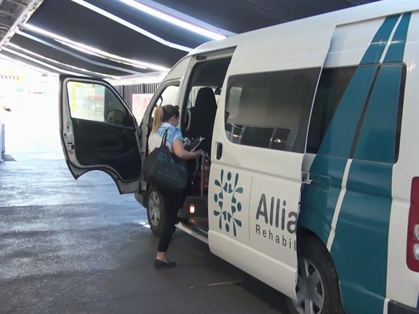 alliance-townsville-outreach-home-visits Team member loading van in Townsville